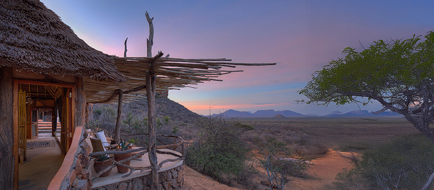 Sunrise casting pastel hues over the Samburu landscape, viewed from a Reteti House veranda.