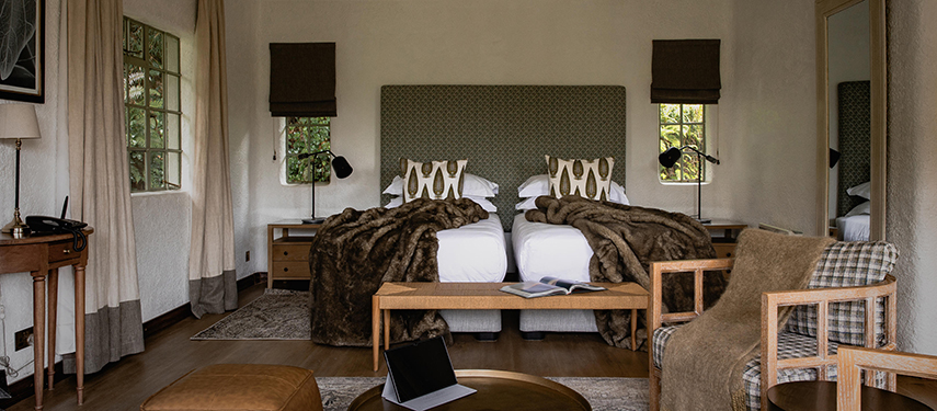 Sumptuous colonial-style twin suite at Sabyinyo Lodge, Volcanoes National Park, Rwanda