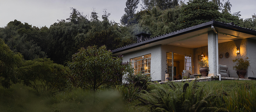 Elegant guest rooms at Sabyinyo Lodge overlook the surrounding mountains of the Volcanoes National Park