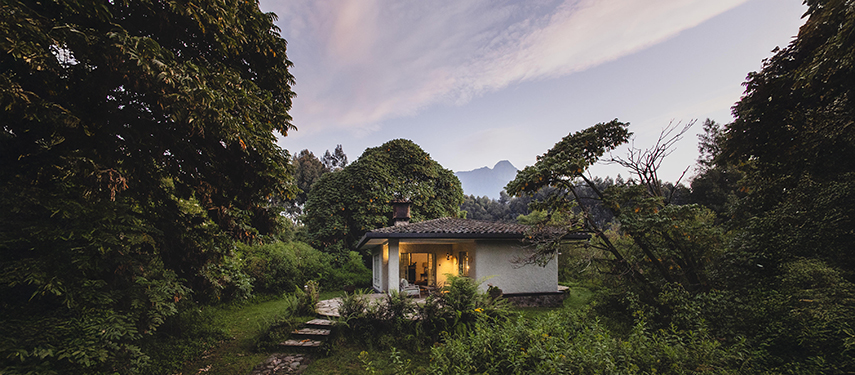 Elegant guest rooms at Sabyinyo Lodge overlook the surrounding mountains of the Volcanoes National Park