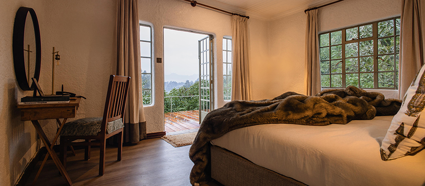 Elegant guest rooms overlook the surrounding mountains of the Volcanoes National Park