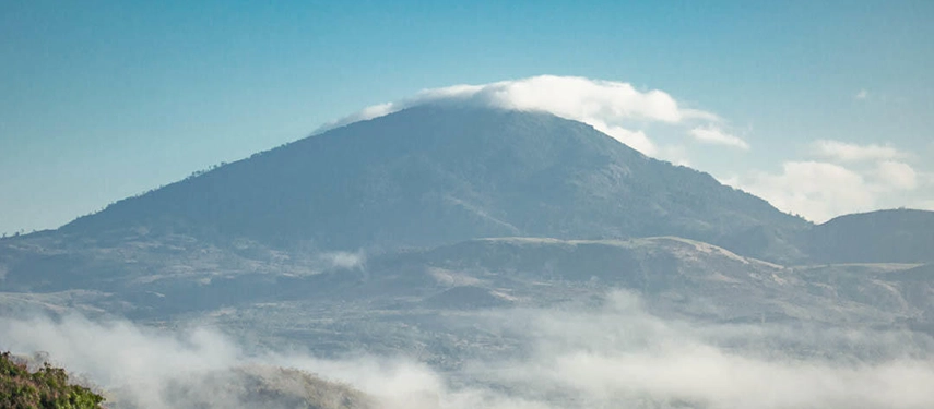 Mount Gorongosa rises above drifting clouds, revealing the dramatic highland landscapes that shape the park’s ecosystems.