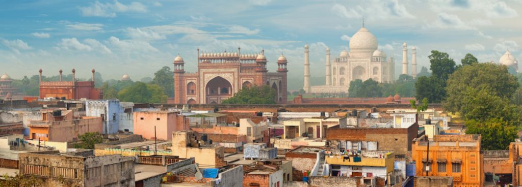 Panoramic view of Delhi with the Taj Mahal in the distance.
