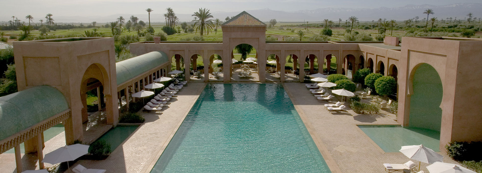 Views of palm trees and a heated outdoor pool send one into relaxation mode at Amanjena