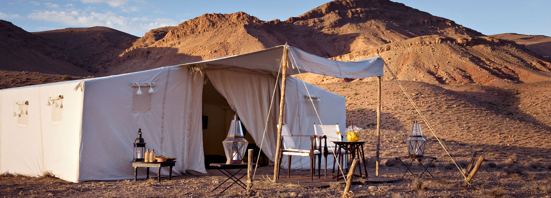 Striking white contrasts against the dunes at Dar Ahlam Dune Camp
