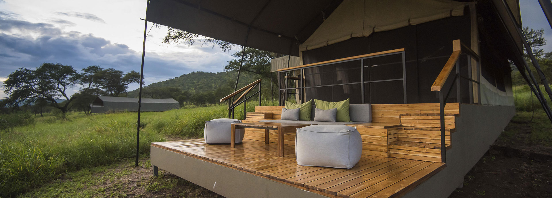 Enjoy a coffee on the wooden deck of your tent and peer out over the Serengeti Plains