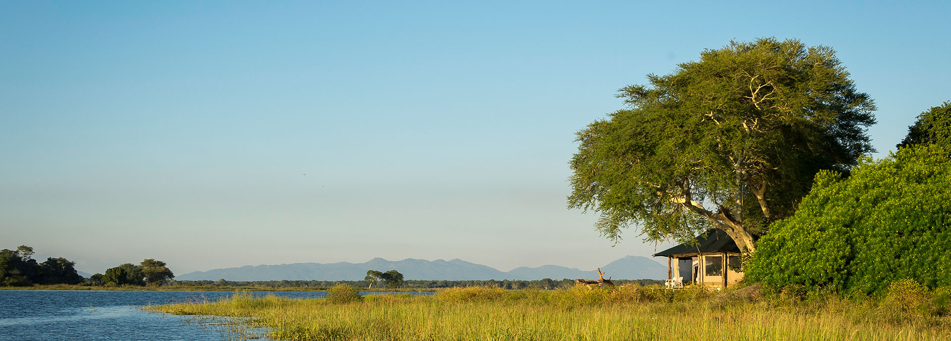 Head out boating in the unspoiled Liwonde National Park at Kuthengo Camp