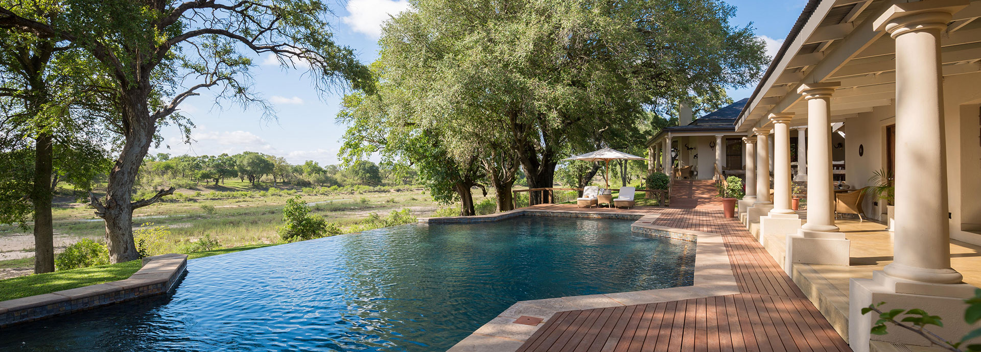 Enjoy expansive views of the river from the pool at Mala Mala Rattray
