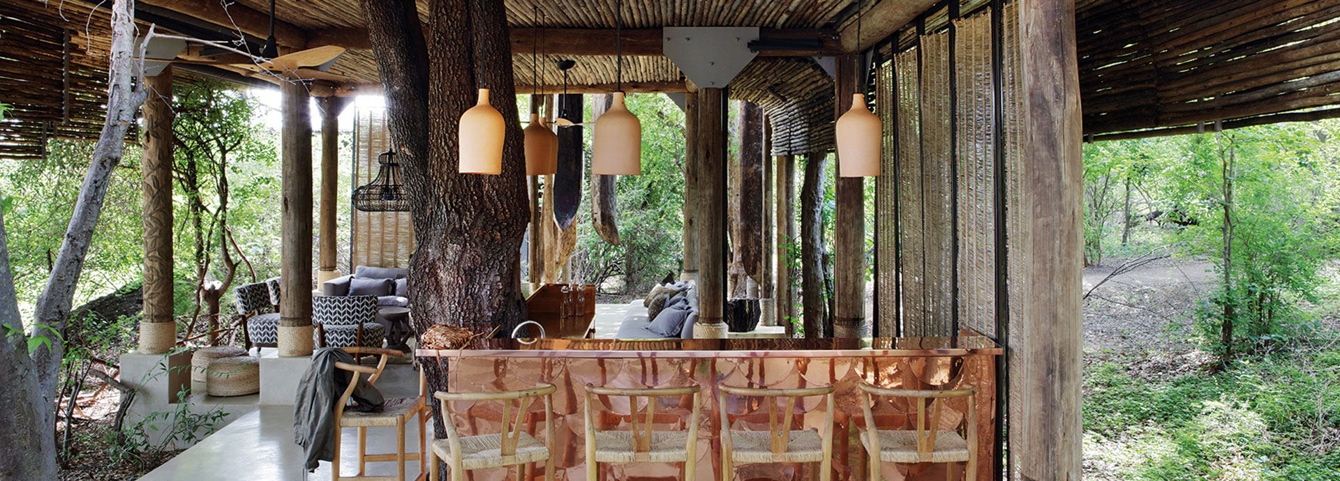 The quietude ensues with an open-air lounge in the forest at Matetsi River Lodge