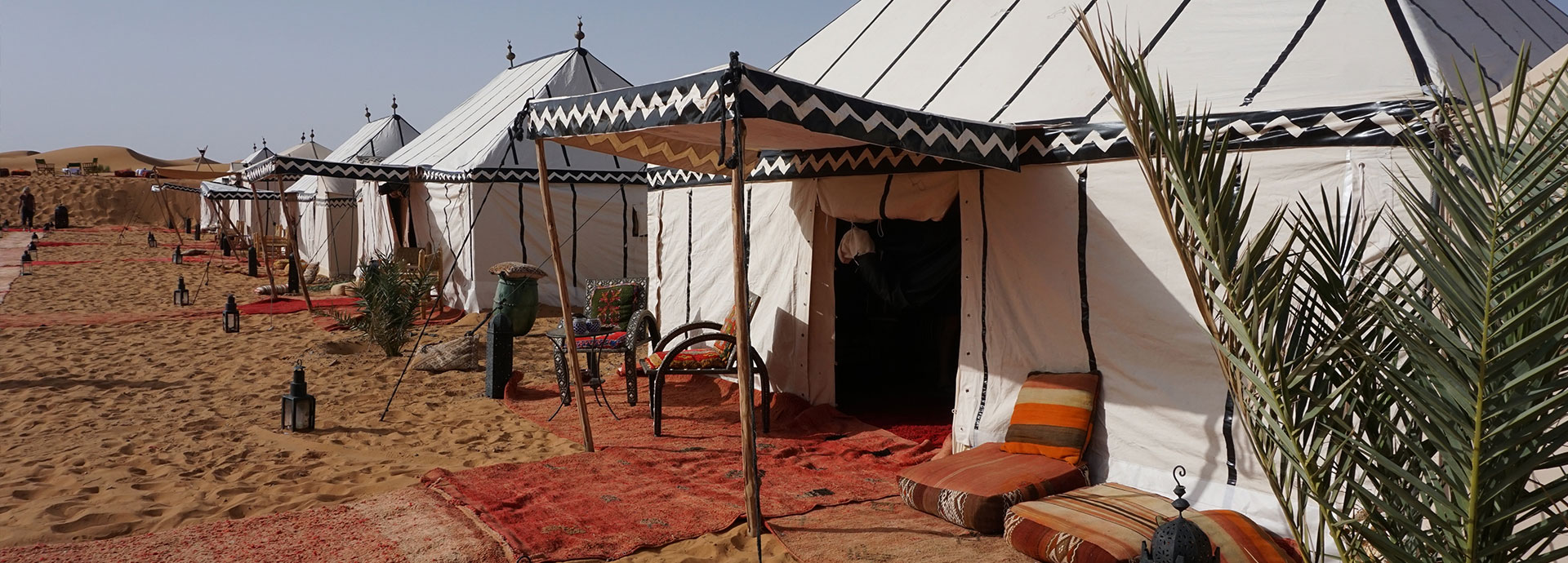 Admire the shifting sands from your tent at Merzouga Luxury Desert Camp