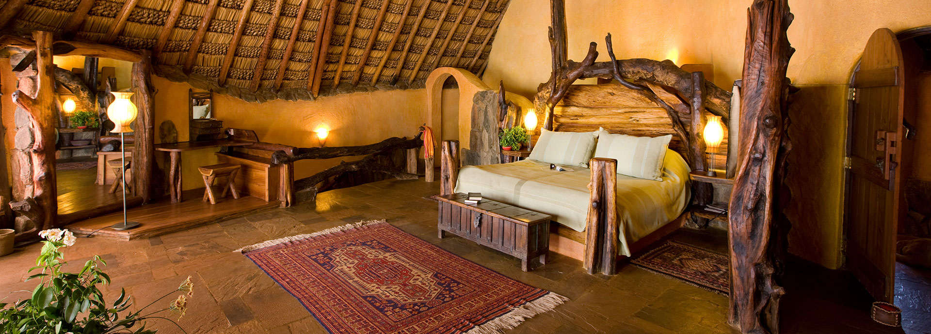 Spacious bedrooms with beautifully designed wooden interiors can be found at Ol Malo House