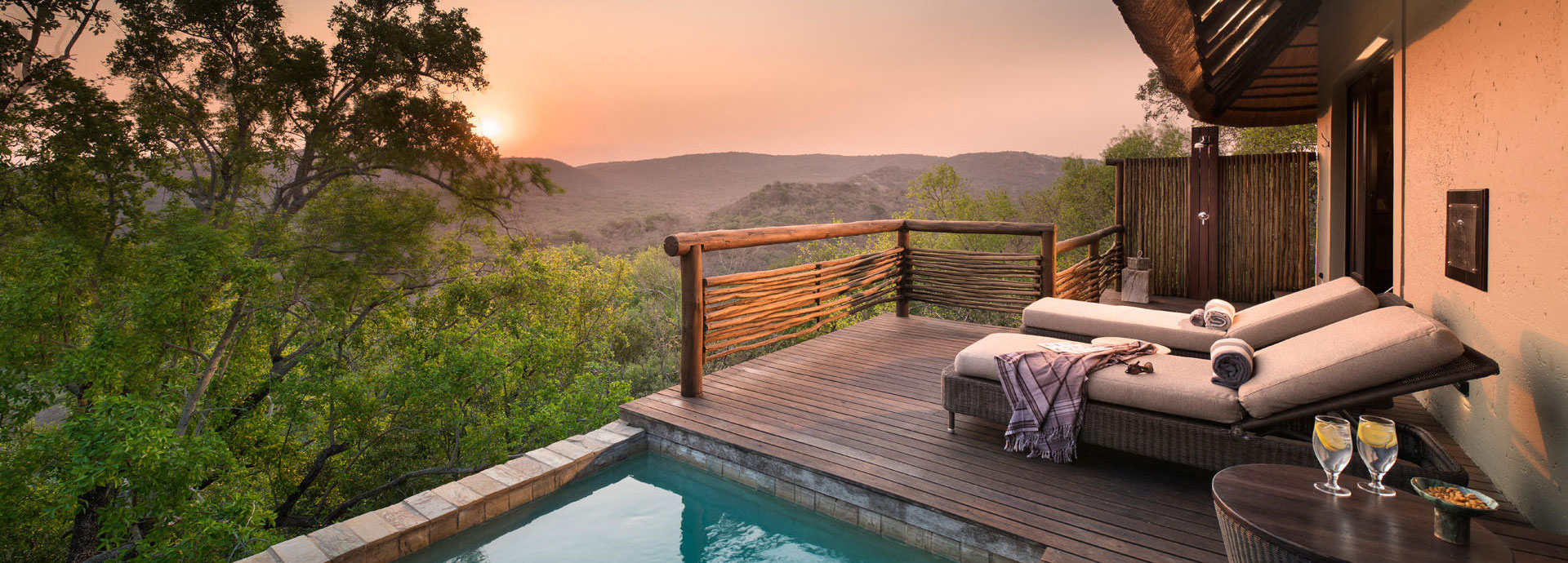 Sunset by the pool overlooking the Ubombo mountain range at Phinda Mountain Lodge
