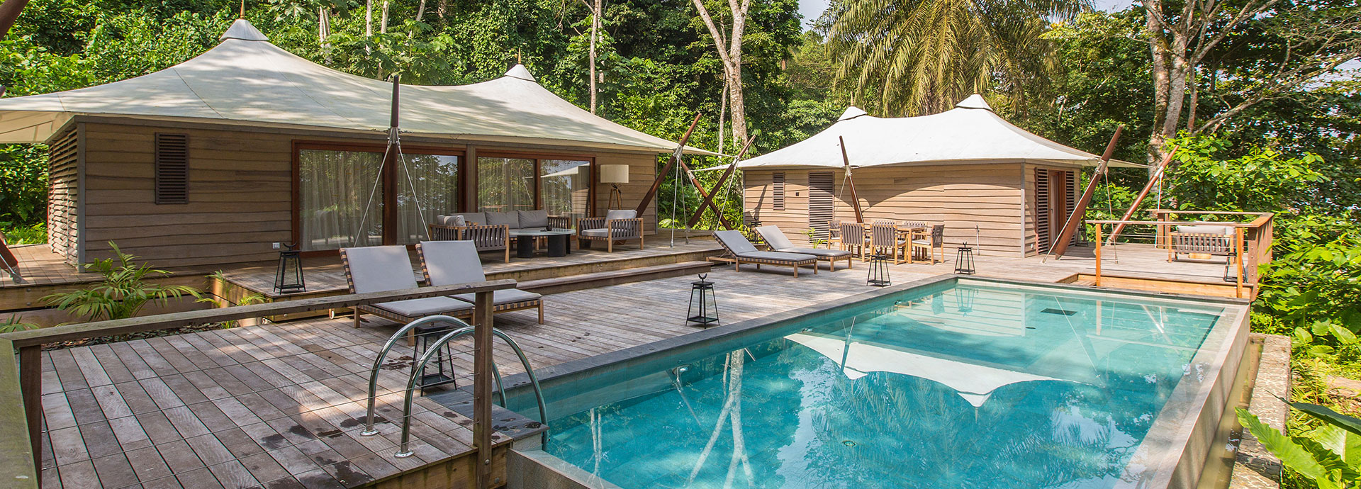 Shade beneath banana trees in the breeze at Sundy Praia