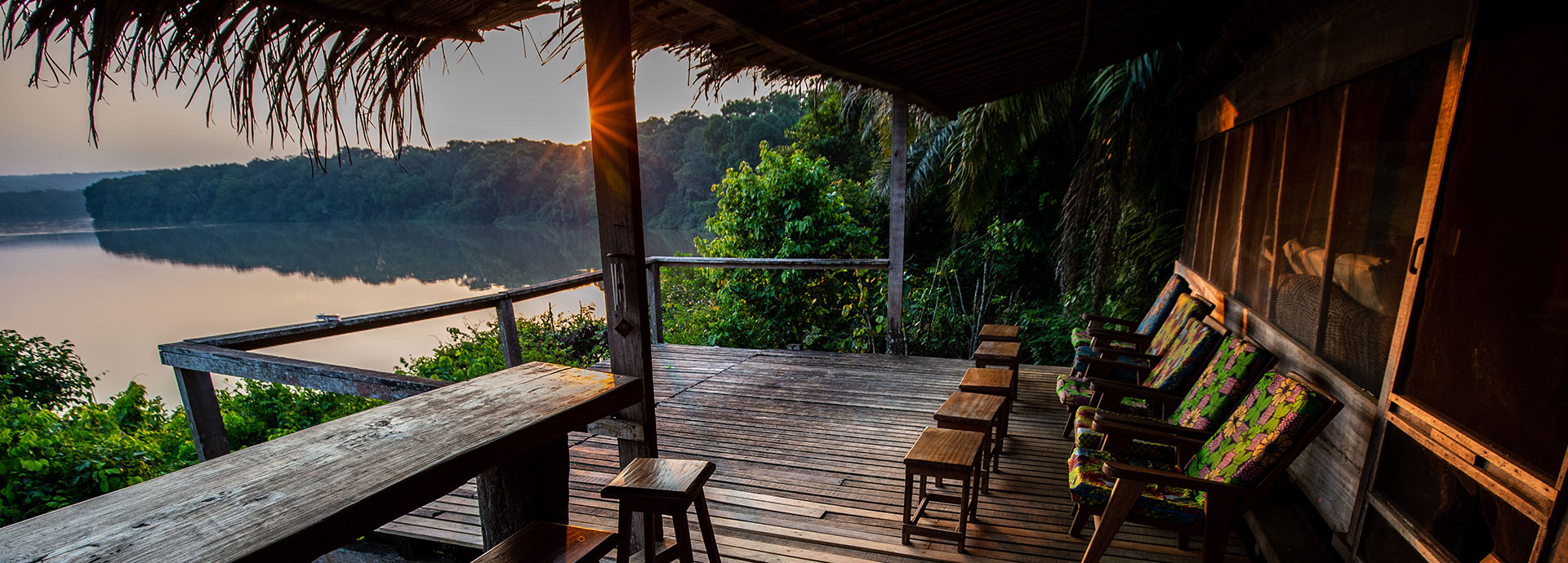 Rustic charm of the observation deck and bar at Sangha Camp, overlooking the Sangha River