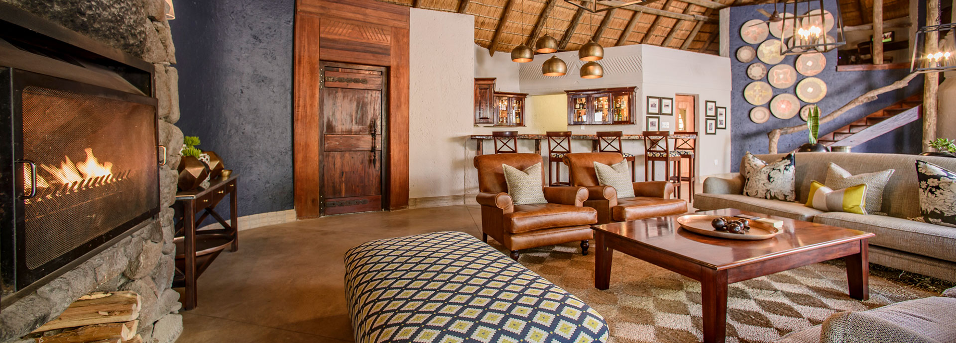 Sit by the fire in the lounge at Savanna after a day out on safari in the Sabi Sands Game Reserve