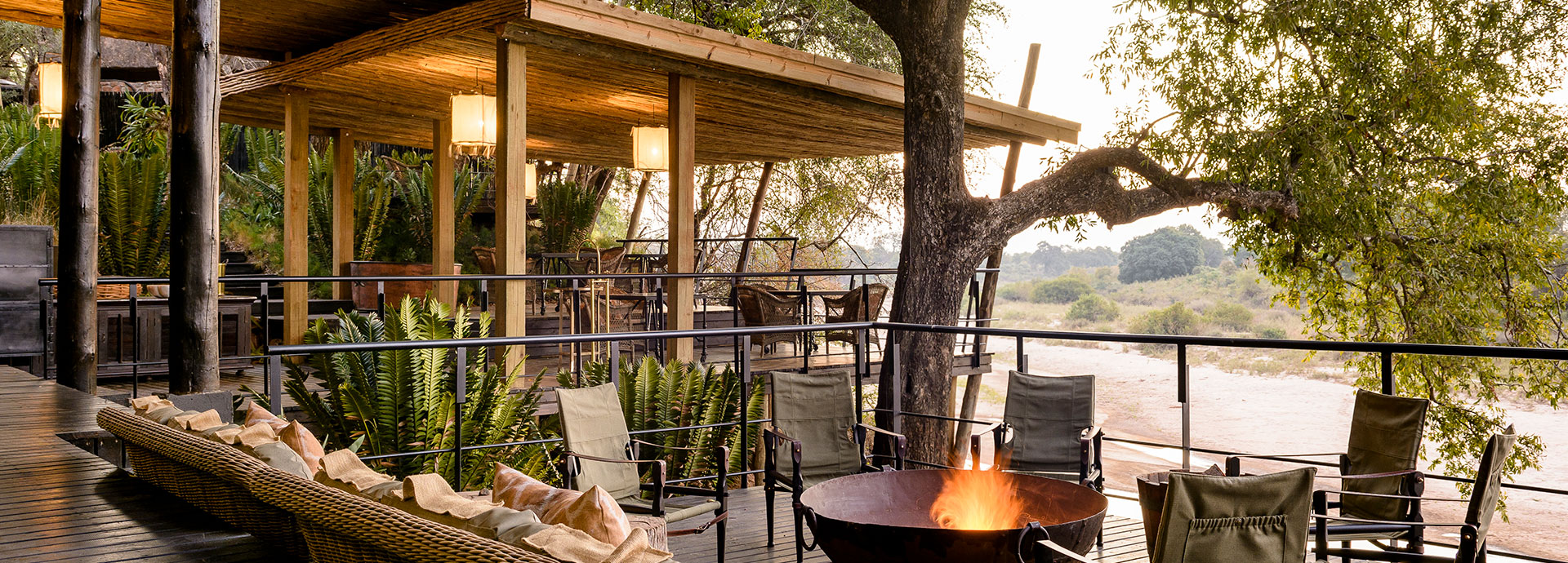 Chat about your day's safari experience at the campfire at Singita Ebony