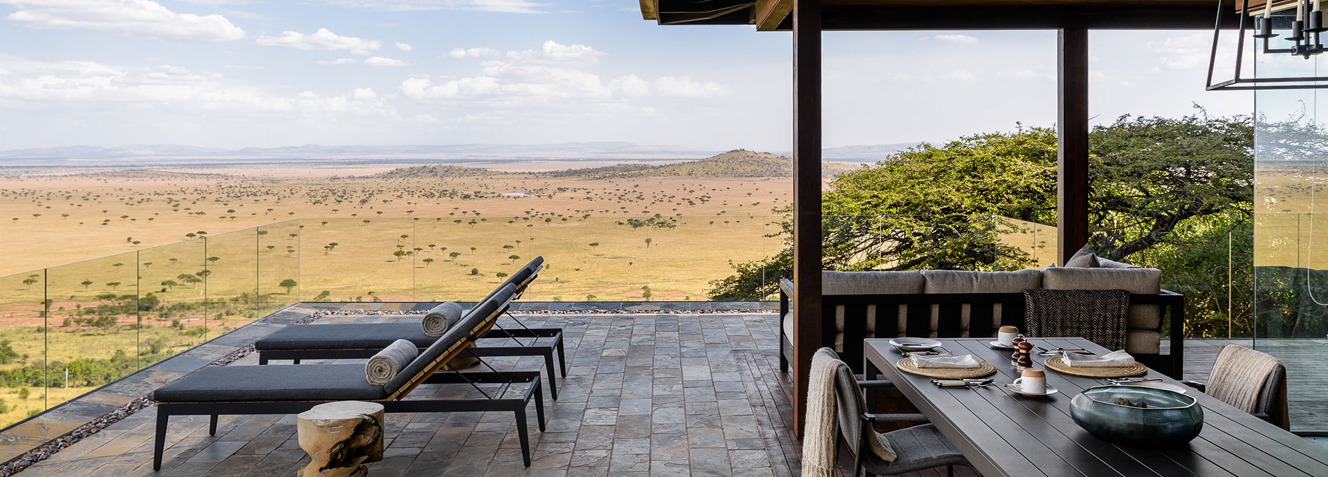 Hillside suite private dining with views of the vast Serengeti from Singita Sasakwa Lodge
