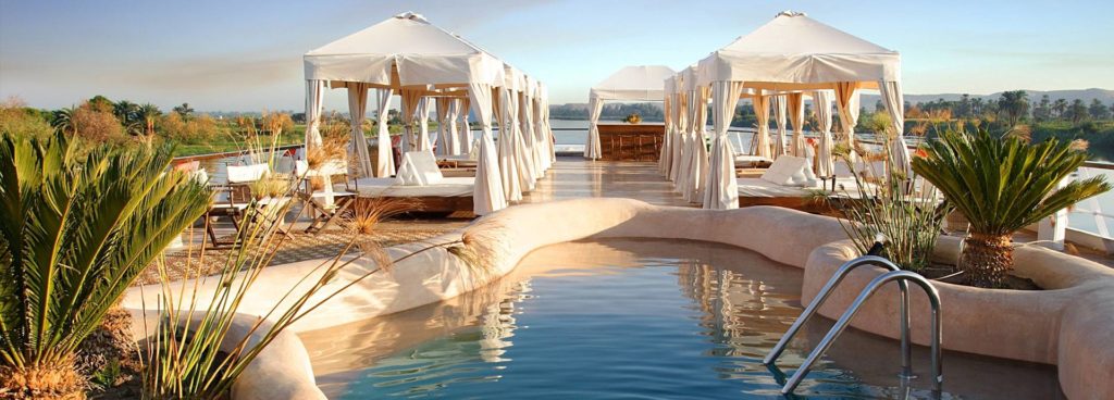 Enjoy stunning views from the pool on the deck on Sanctuary Sun Boat III on a Nile luxury cruise