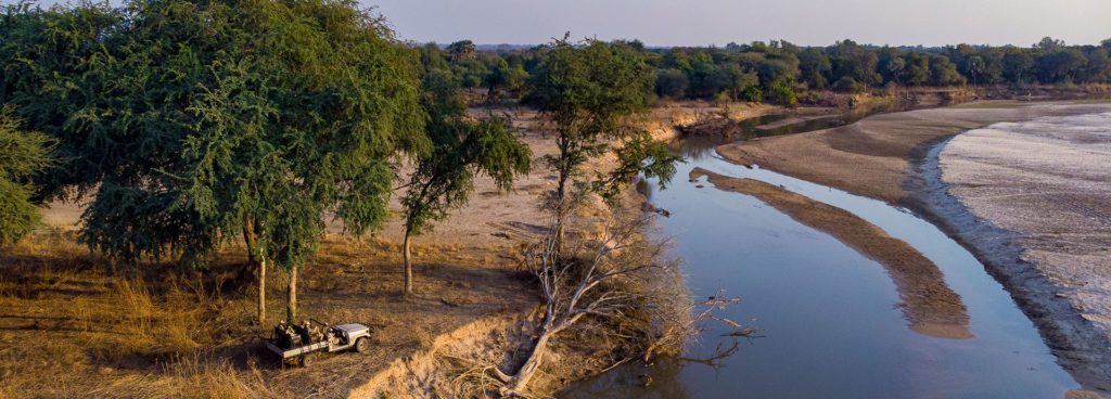 A safari game drive on the banks of South Luangwa River in Zambia