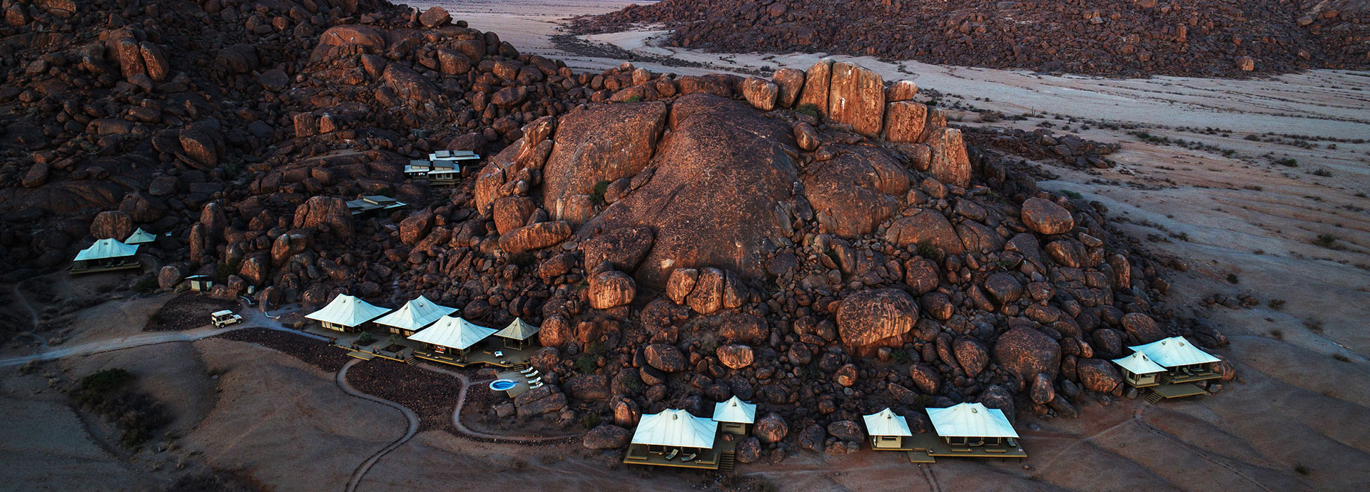 Spacious tents dotted between large granite rocks at Wolwedans Boulders