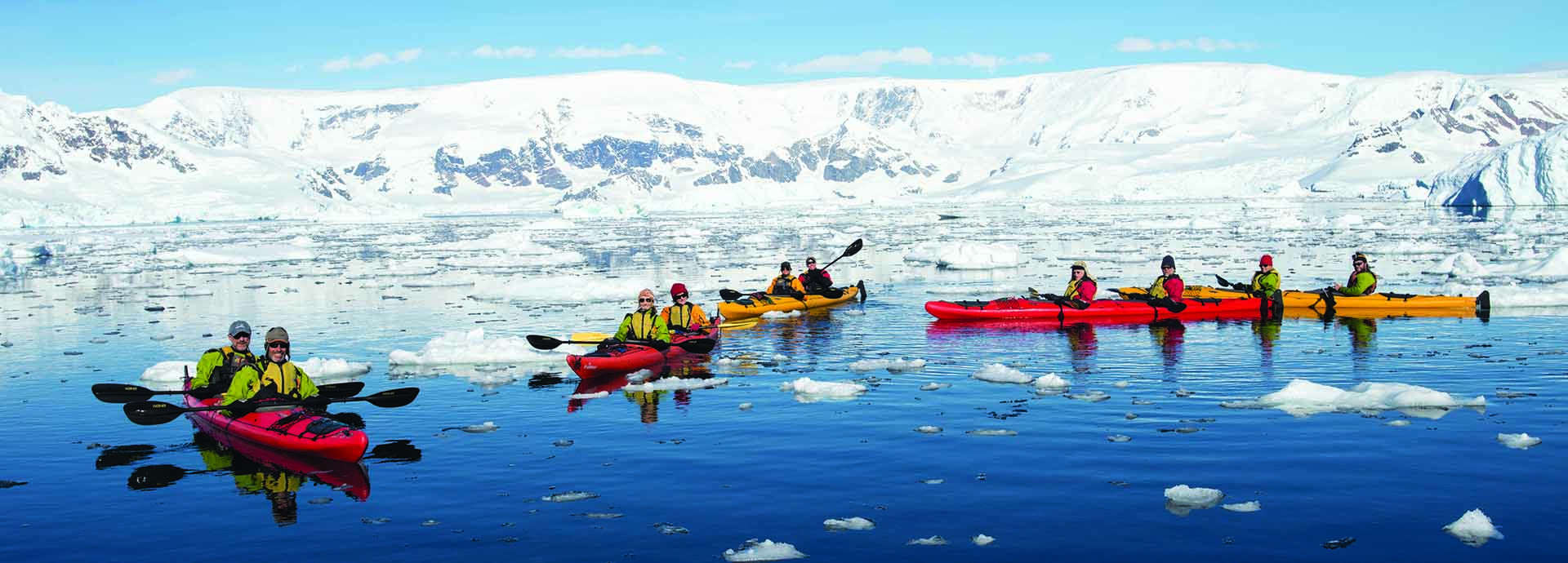 Tourists Sea Kayaking In Portal Point, Antarctica