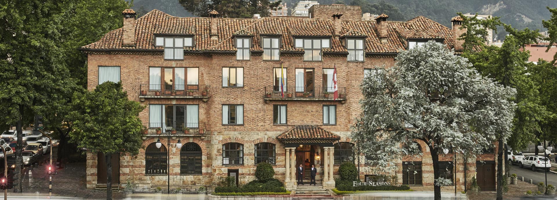 Exterior view of Four Seasons Casa Medina, showcasing the historic sandstone façade and architectural details in Bogotá.