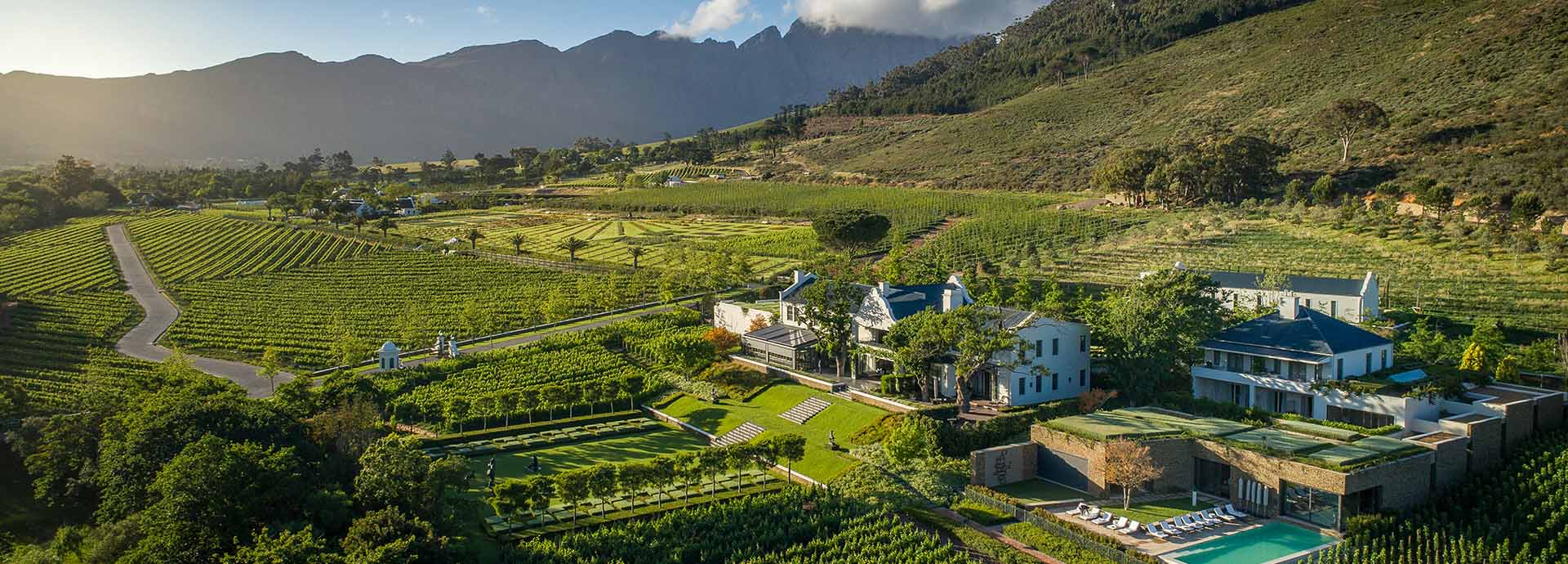 Views across the Franschhoek Valley of vineyards and towering mountains at Leeu Estates