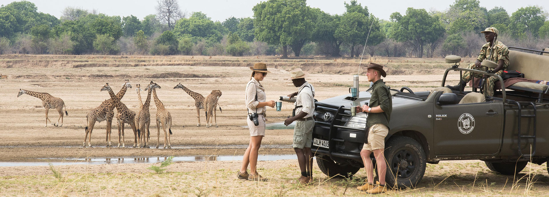 A coffee break while viewing giraffe on a game drive in South Luangwa National Park, Zambia