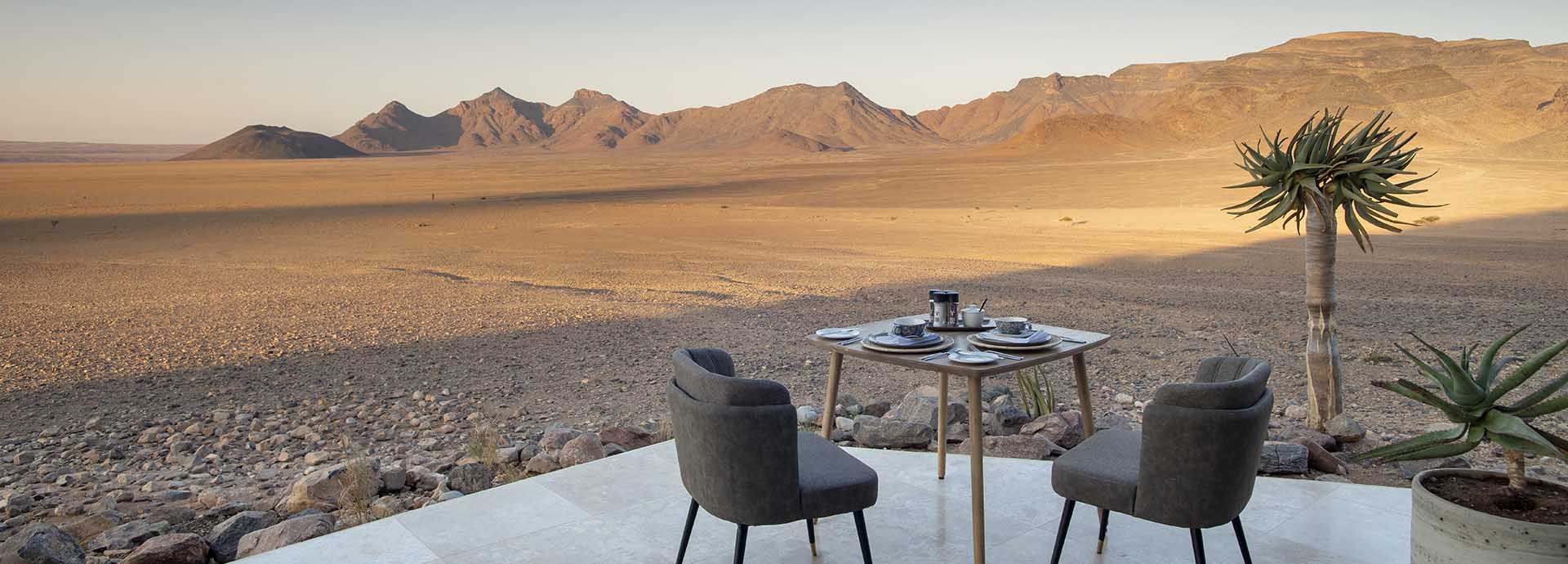 Enjoy expansive views of the Namib desert over tea at andBeyond's Sossusvlei Desert Lodge in Namibia