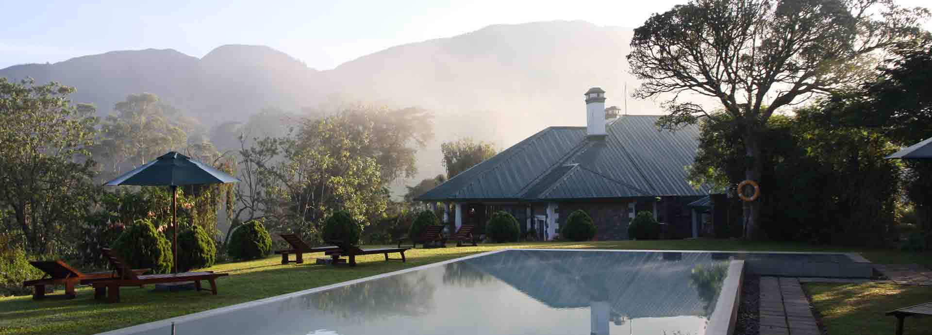 Ceylon Tea Trails bungalow and pool on a misty morning