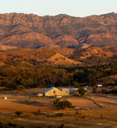 A classic homestead at sunset with hills in the background in the outback of Western Australia