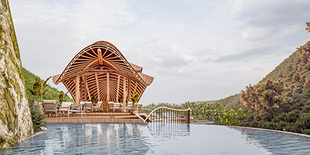 The extraordinary organic-designed pool chalet and deck at Erebero Hills luxury lodge in Uganda