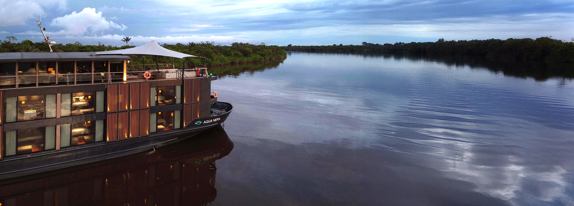 The Aqua Nera luxury boat on a Peruvian Amazon River cruise at sundown