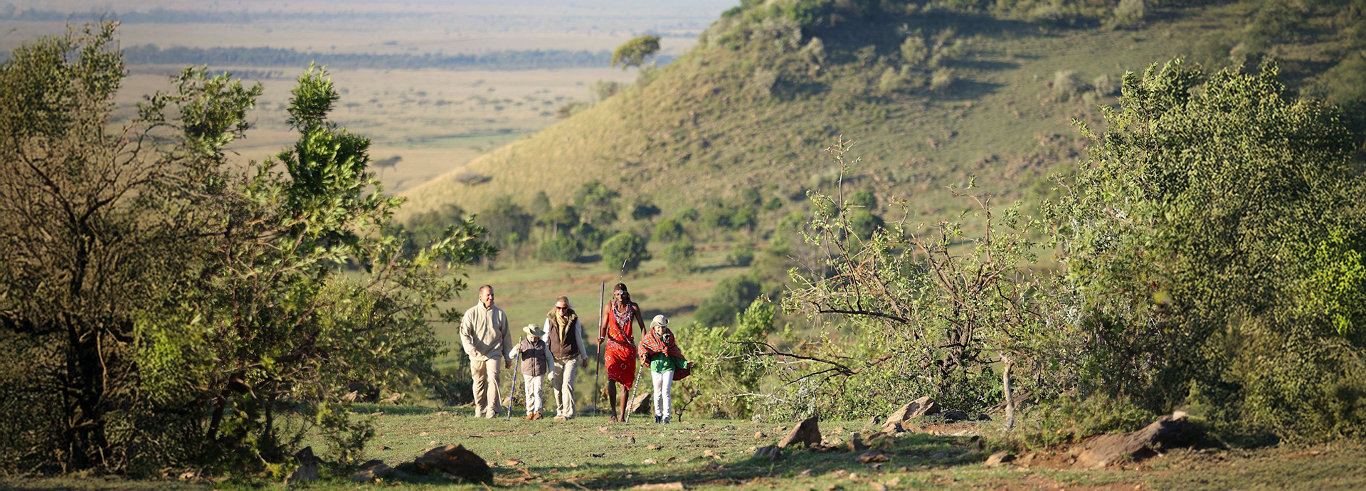 Young Family On A Walking Safari In Laikipia Kenya