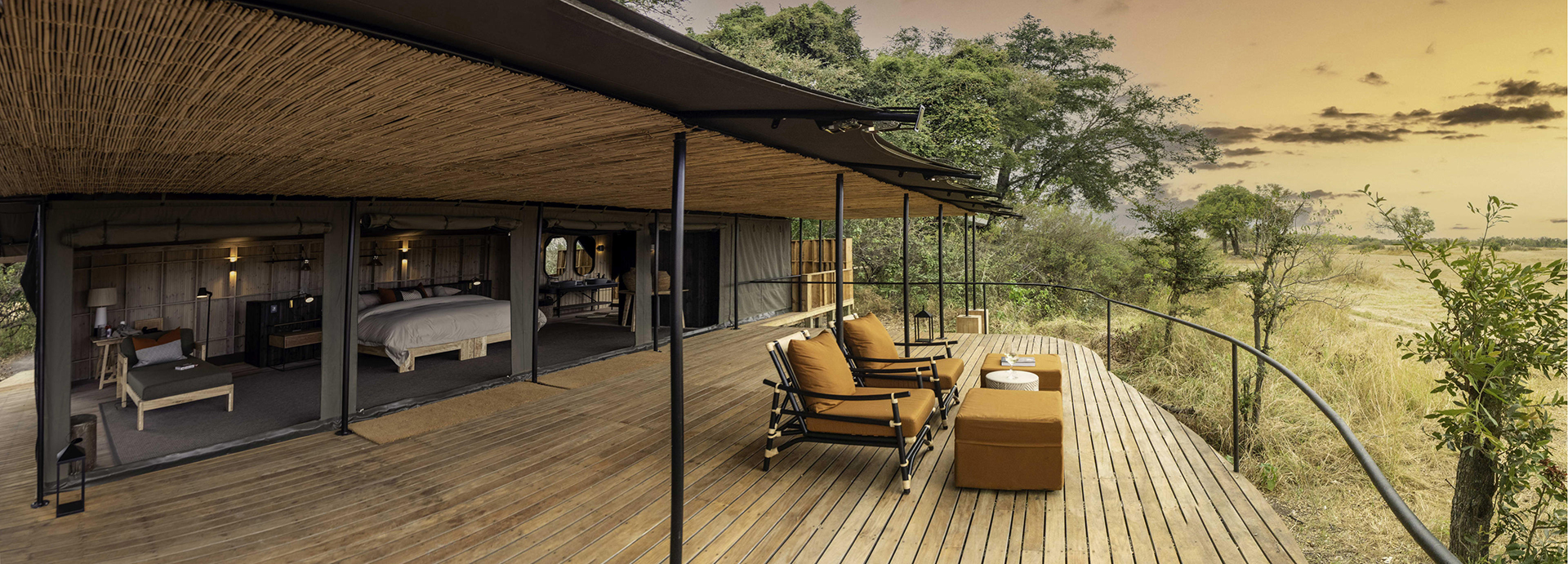 Expansive private deck of a Kiri Camp tent with lounge chairs overlooking the Okavango Delta.