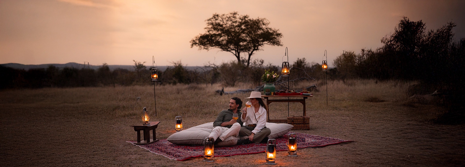 Sunset Couple Picnic Lanterns Safari Scene Jpg Masiya's Camp Kruger National Park