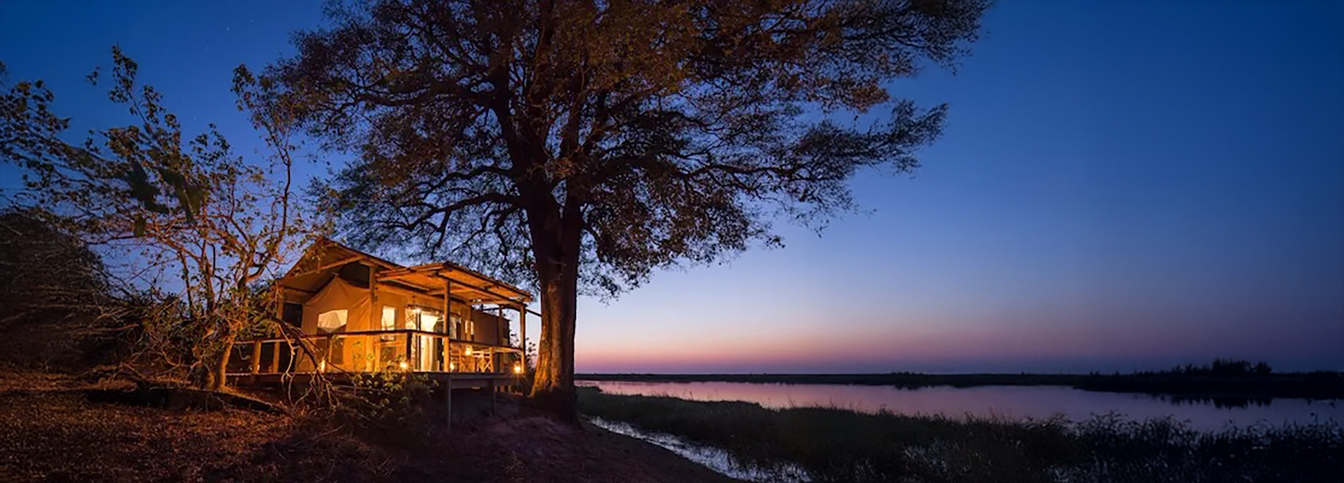 Linyanti Tented Camp at sunset overlooking thr Linyanti River in Botswana