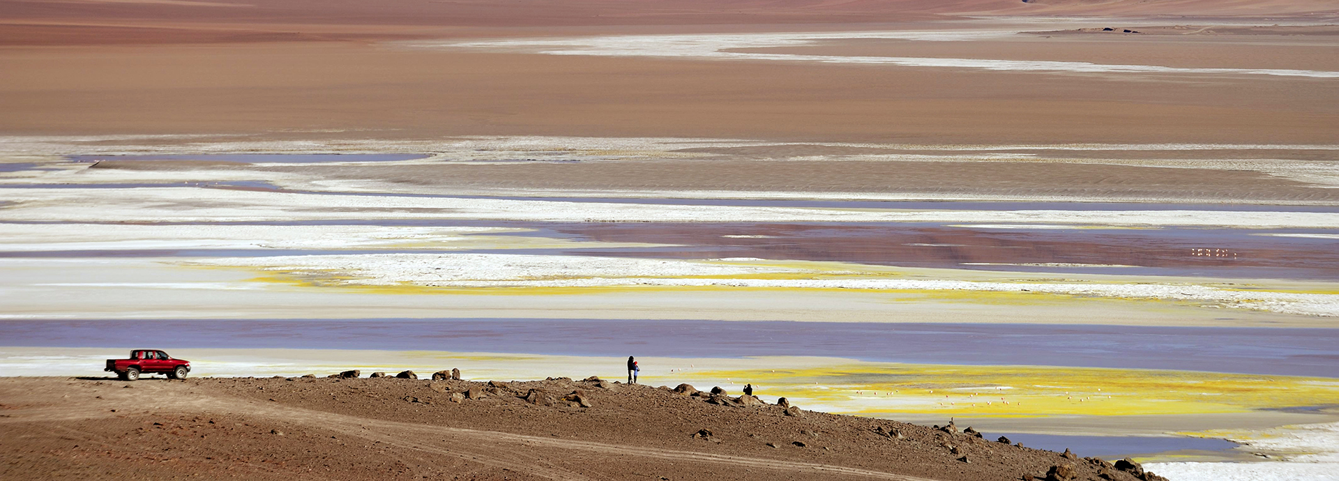 A 4x4 parks near the salt pans of the Atacama Desert
