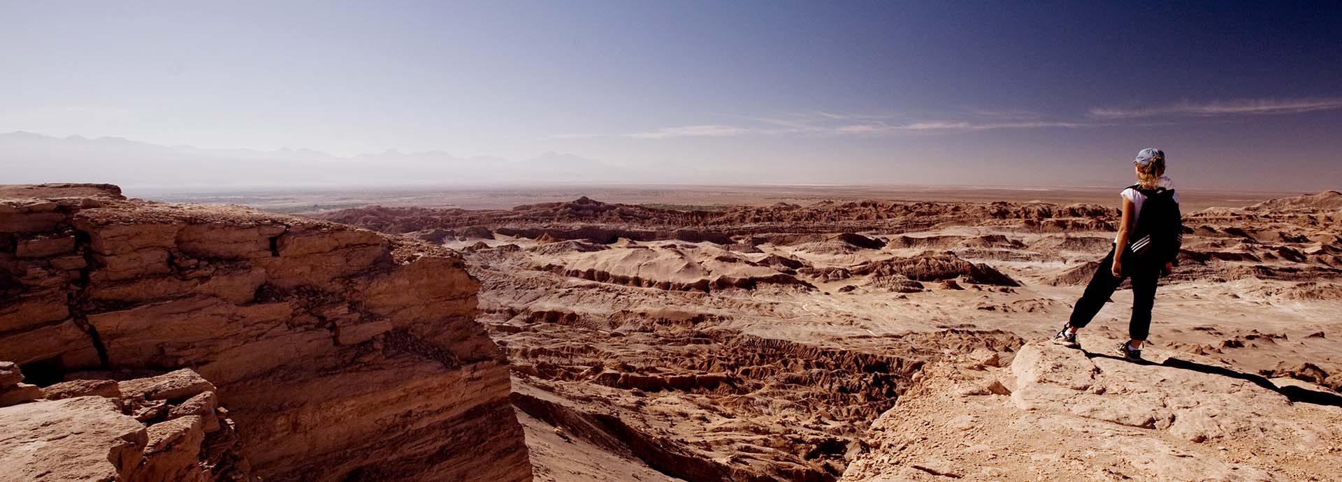Woman gazing across a canyon in the Atacama Desert of Chile