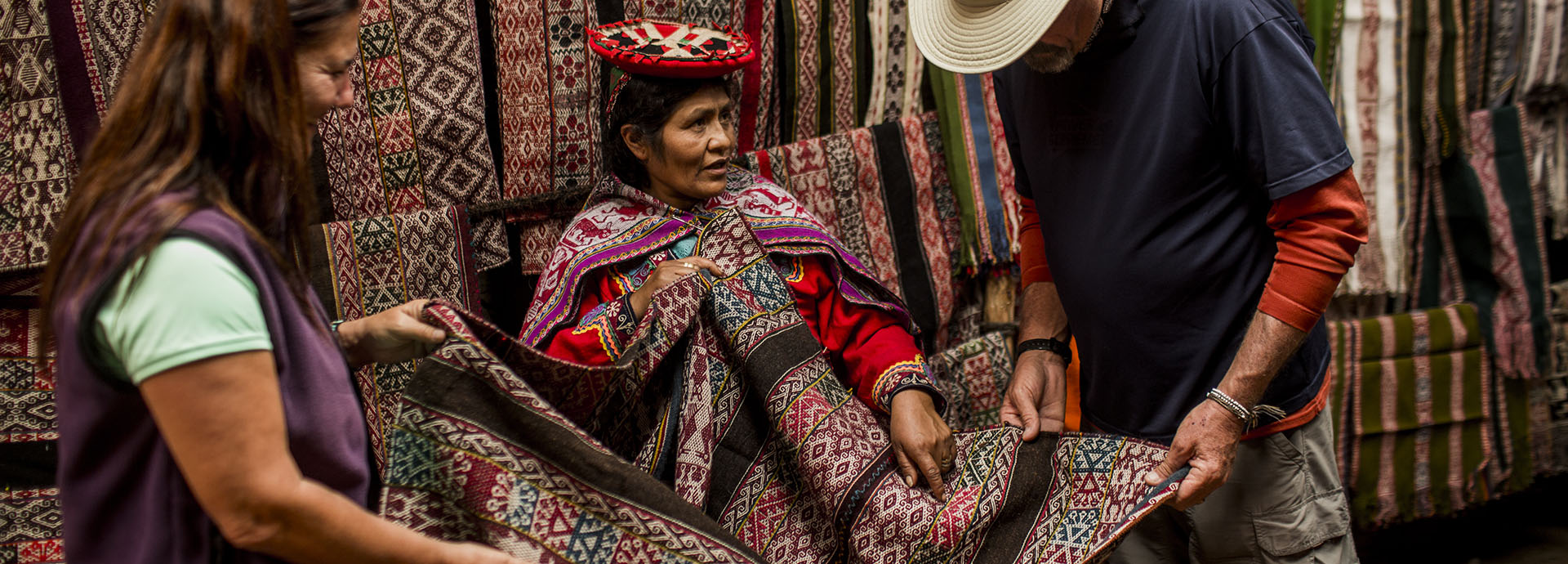 Meet local women and admire their colours and culture while taking part in the Lares Adventure