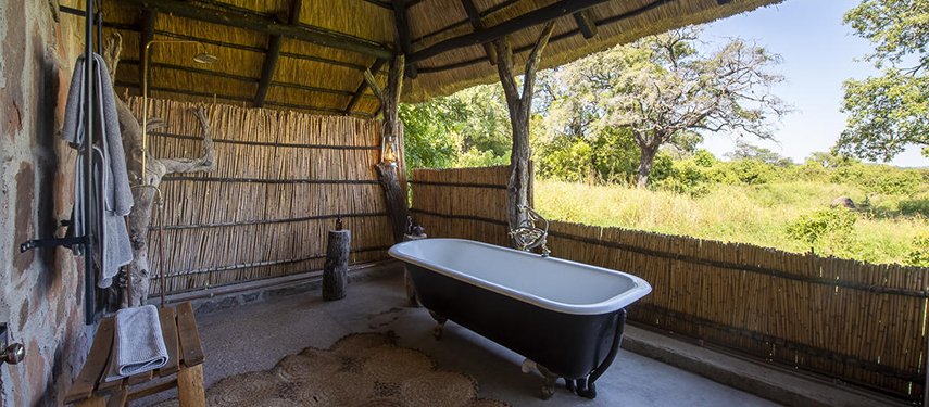 En suite bathroom with a view at Bumbusi Wilderness Camp, Hwange National Park, Zimbabwe