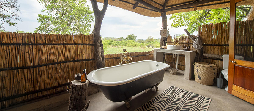 En suite bathroom with a view at Bumbusi Wilderness Camp, Hwange National Park, Zimbabwe