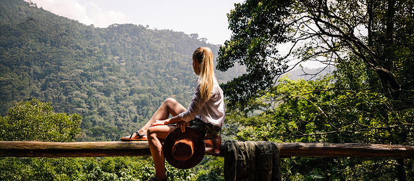 Guest enjoying the view of Bwindi Impenetrable Forest at Gorilla Forest Lodge, Uganda