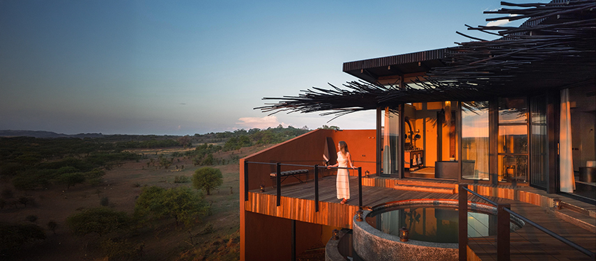 Guest watching thew sunset at Chichele Presidential luxury safari Lodge in South Luangwa National Park, Zambia