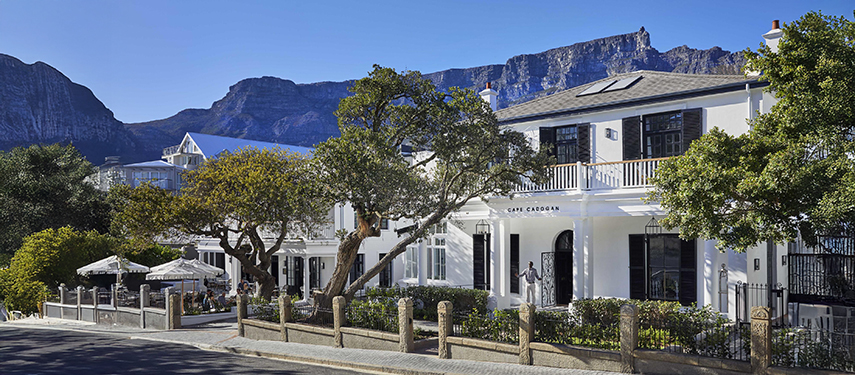 Street view of Cape Cadogan Boutique Hotel with Table Mountain in the background
