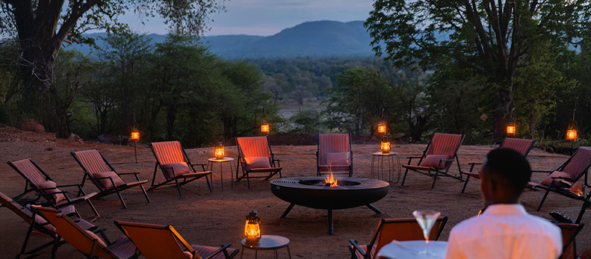 Boma and campfire at Chichele Presidential Lodge, Zambia