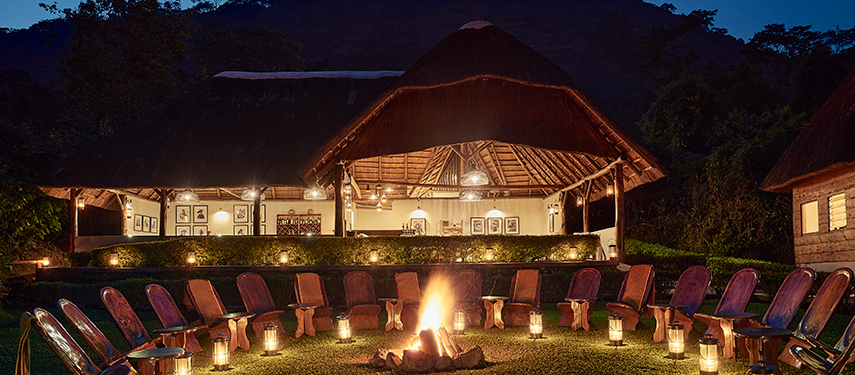 Gorilla Forest Lodge exterior with campfire in Bwindi Impenetrable Forest, Uganda