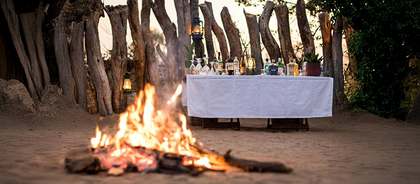 Campfire in a boma at Mankwe Tented Retreat in Botswana