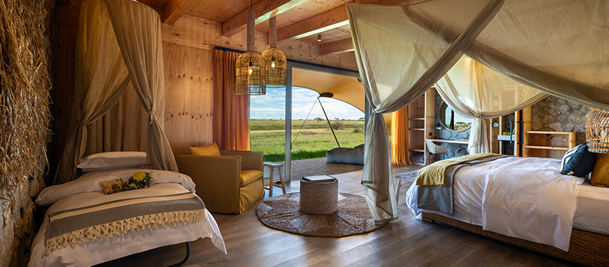 Luxurious interior of a family suite at Namiri Plains tented camp retreat
