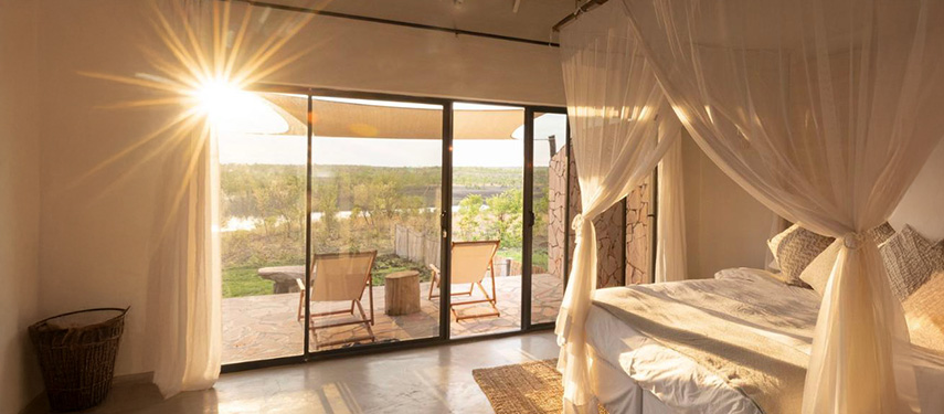 Double bedroom with a view at Nantwich safari Lodge, Hwange National Park